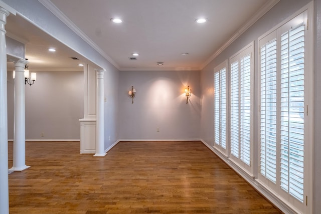 2103 Juanita Dr, Arlington, TX 76013 - empty room with crown molding, wood finished floors, baseboards, ornate columns, and recessed lighting