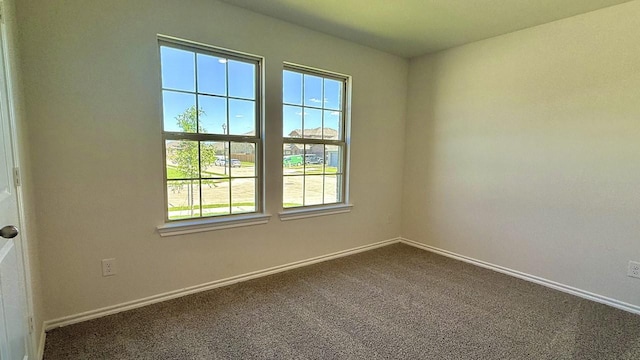601 Banks Pl, Josephine, TX 75135 - spare room featuring dark colored carpet and baseboards