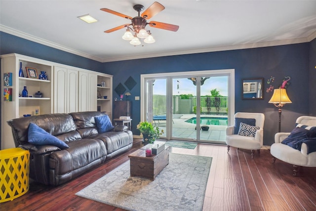 living area featuring crown molding, ceiling fan, and hardwood / wood-style floors