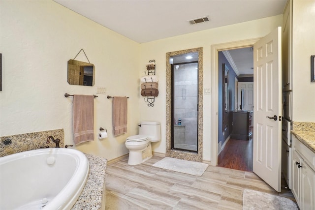 full bath with a garden tub, visible vents, vanity, toilet, and a stall shower