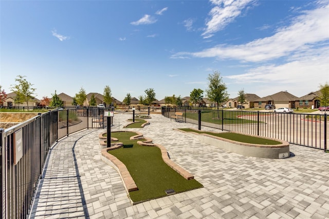 view of home's community with fence and a residential view