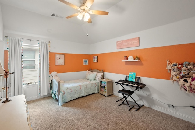 bedroom featuring visible vents, carpet flooring, baseboards, and vaulted ceiling