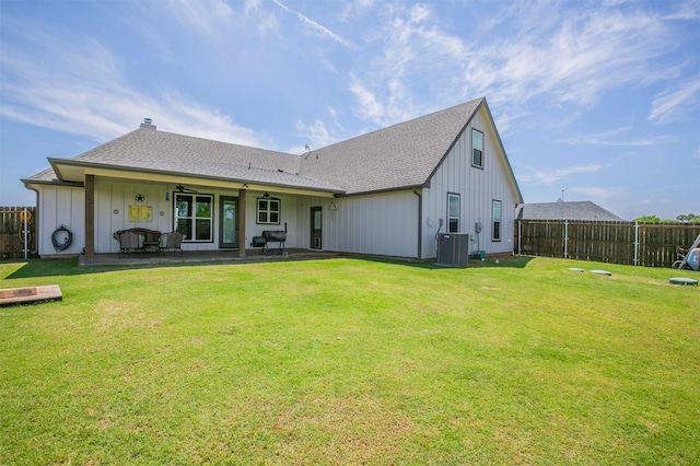 250 Beulah Rd, Millsap, TX 76066 - back of property with board and batten siding, a lawn, and a fenced backyard