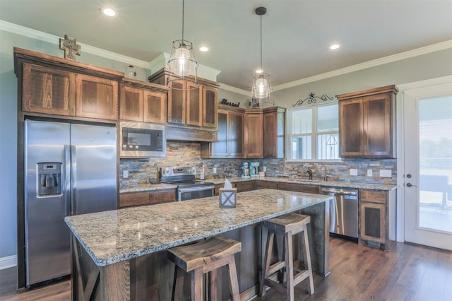 250 Beulah Rd, Millsap, TX 76066 - kitchen with appliances with stainless steel finishes, plenty of natural light, tasteful backsplash, and a center island