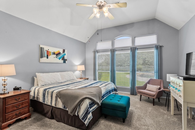 carpeted bedroom featuring lofted ceiling and a ceiling fan