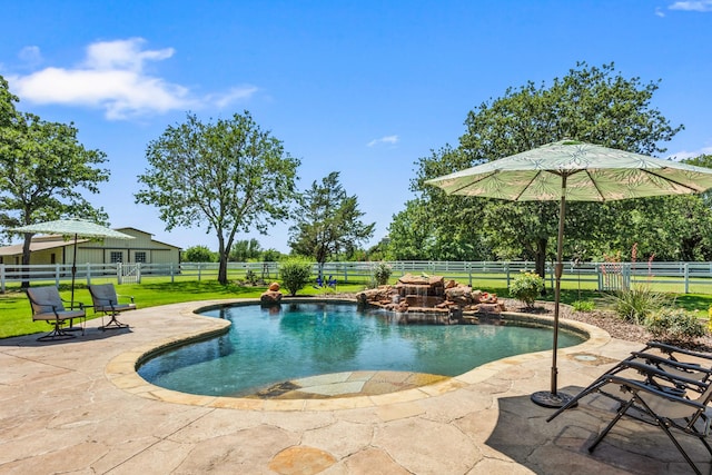 view of swimming pool with a patio