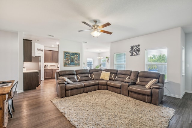 3225 Sweetwater Way, Sherman, TX 75090 - living area with baseboards, ceiling fan with notable chandelier, wood finished floors, and visible vents