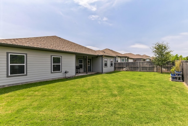 3225 Sweetwater Way, Sherman, TX 75090 - rear view of house featuring a fenced backyard, a patio area, a yard, and a shingled roof
