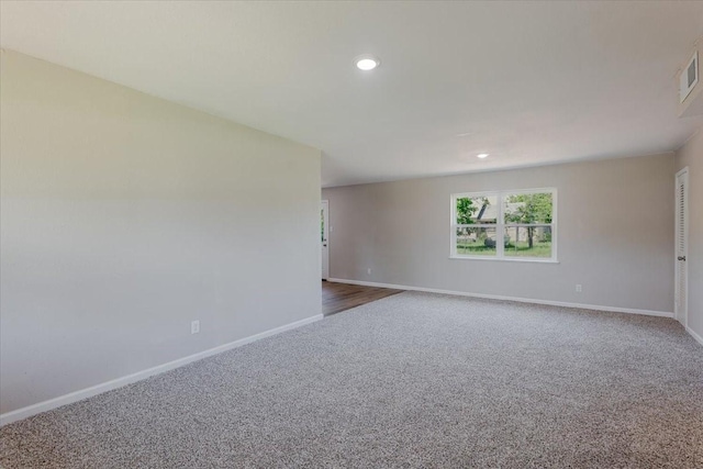 1017 SE 21st St, Mineral Wells, TX 76067 - empty room featuring carpet floors, recessed lighting, and baseboards