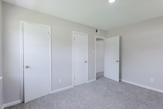 1017 SE 21st St, Mineral Wells, TX 76067 - unfurnished bedroom featuring visible vents, carpet flooring, and baseboards