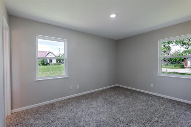 1017 SE 21st St, Mineral Wells, TX 76067 - empty room featuring carpet floors, recessed lighting, and baseboards