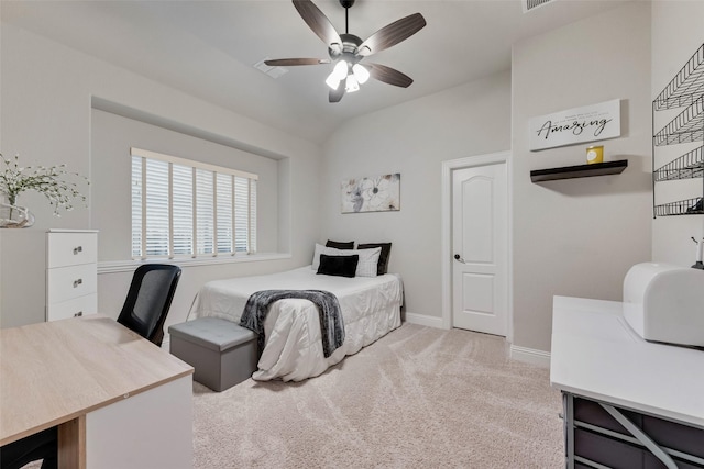 carpeted bedroom featuring baseboards, lofted ceiling, and a ceiling fan
