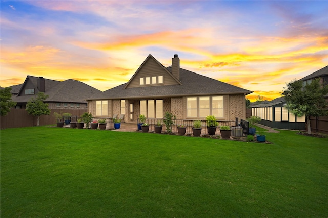 749 Copperleaf Dr, Midlothian, TX 76065 - back of property featuring brick siding, a chimney, a patio area, and a shingled roof