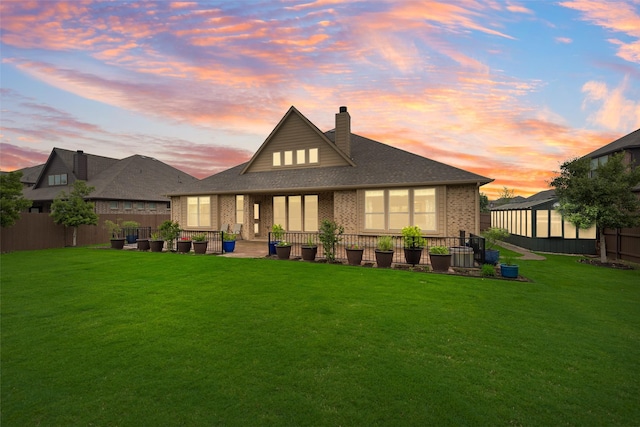 749 Copperleaf Dr, Midlothian, TX 76065 - rear view of property with brick siding, a chimney, and a shingled roof