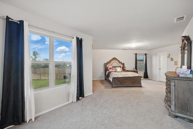 bedroom featuring carpet floors, baseboards, and visible vents