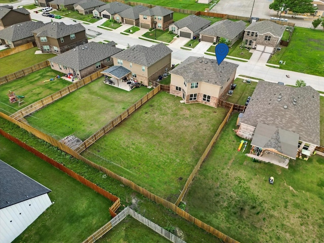 birds eye view of property with a residential view