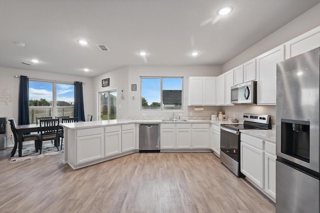kitchen with visible vents, a sink, appliances with stainless steel finishes, and recessed lighting