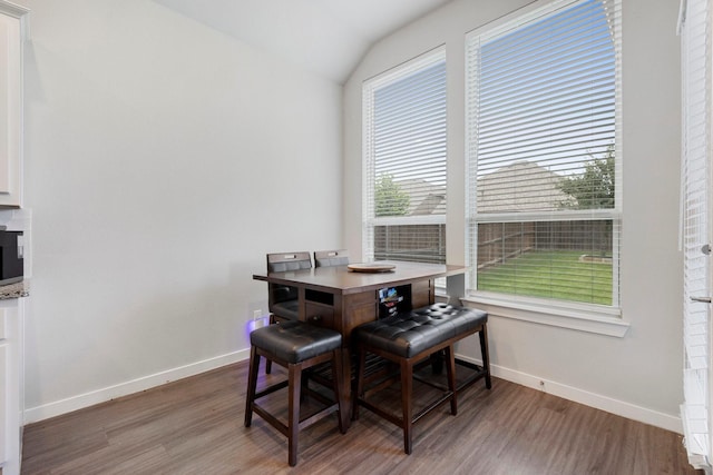1732 Journey Forth Trl, Wylie, TX 75098 - dining space featuring baseboards, wood finished floors, and lofted ceiling