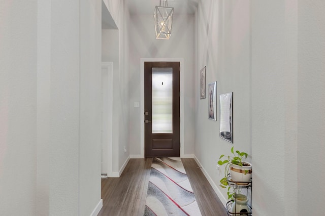 1732 Journey Forth Trl, Wylie, TX 75098 - doorway featuring baseboards and wood finished floors