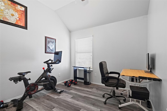 office space with baseboards, wood finished floors, and lofted ceiling