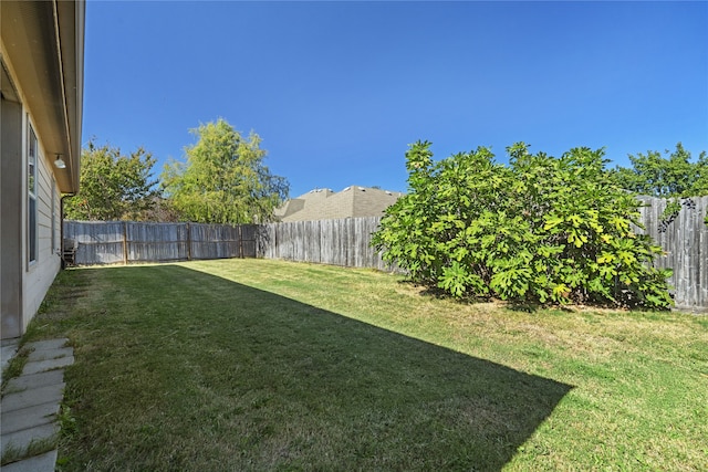 view of yard with a fenced backyard