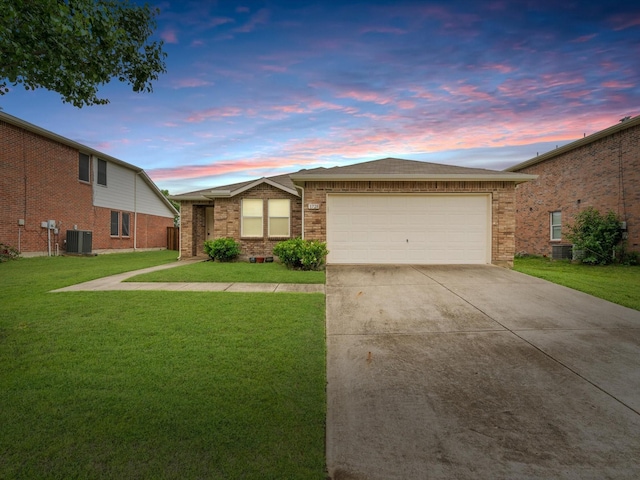 1728 Creek Bend Ln, Little Elm, TX 75068 - ranch-style house featuring central AC unit, an attached garage, concrete driveway, and a front lawn
