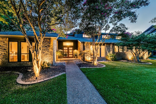 7509 Spring Meadow Ln, Garland, TX 75044 - view of front of property featuring a front lawn and brick siding