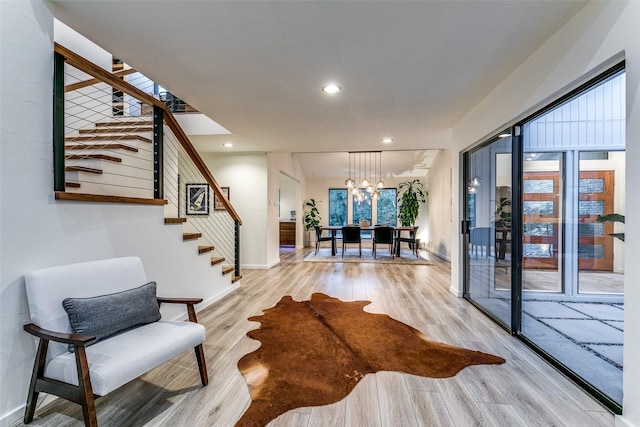 7509 Spring Meadow Ln, Garland, TX 75044 - living room featuring stairway, light wood-type flooring, a chandelier, recessed lighting, and baseboards