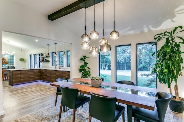7509 Spring Meadow Ln, Garland, TX 75044 - dining space featuring light wood-style flooring and a chandelier
