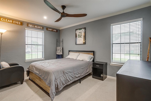bedroom with baseboards, light colored carpet, multiple windows, and ornamental molding