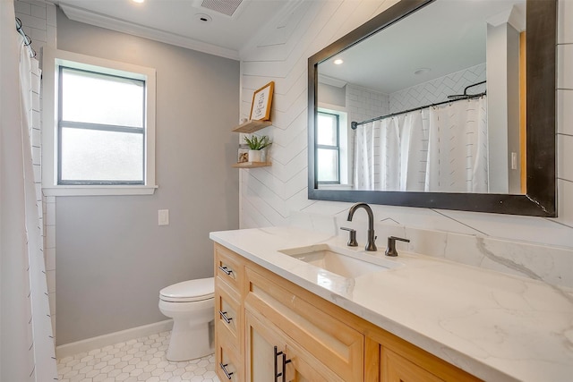 full bathroom with visible vents, crown molding, vanity, baseboards, and toilet