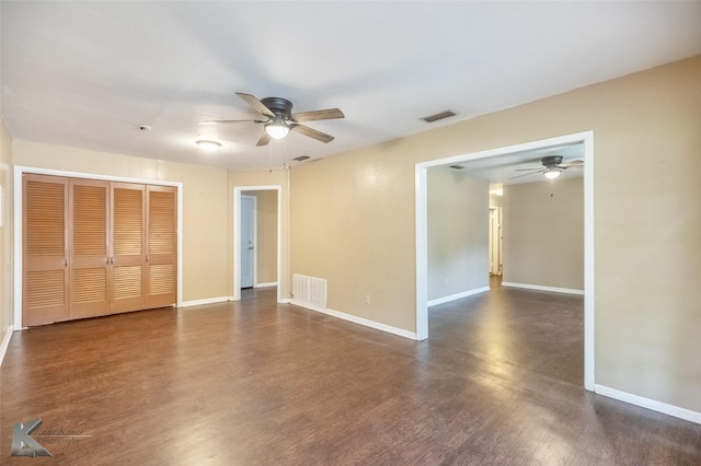 2317 Yorktown Dr, Abilene, TX 79603 - unfurnished bedroom featuring baseboards, visible vents, dark wood-style floors, and a closet