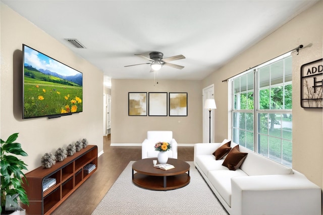 2317 Yorktown Dr, Abilene, TX 79603 - living area featuring baseboards, a ceiling fan, wood finished floors, and visible vents