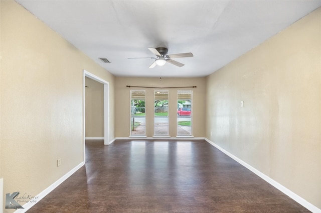 2317 Yorktown Dr, Abilene, TX 79603 - empty room with ceiling fan, visible vents, baseboards, and dark wood finished floors