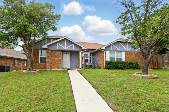 view of front of home featuring brick siding and central AC unit