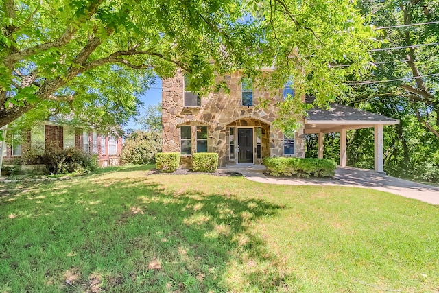 315 Lakeside Dr, Rockwall, TX 75032 - view of property hidden behind natural elements featuring stone siding and a front lawn