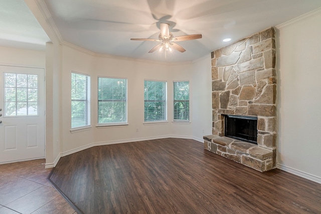 315 Lakeside Dr, Rockwall, TX 75032 - unfurnished living room with a ceiling fan, wood finished floors, ornamental molding, a stone fireplace, and baseboards