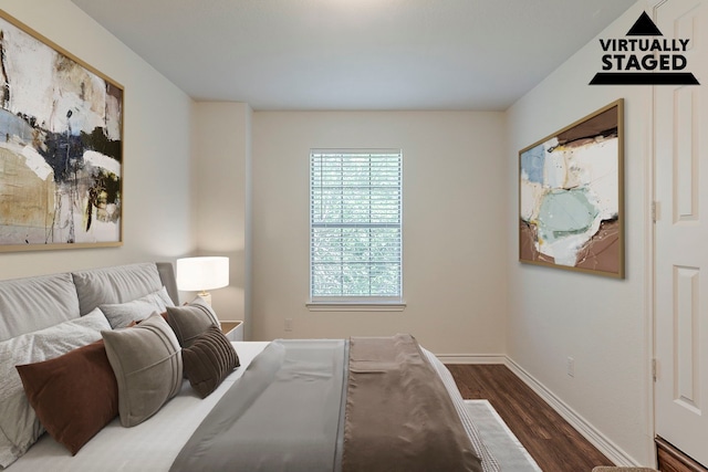 315 Lakeside Dr, Rockwall, TX 75032 - bedroom featuring dark wood finished floors and baseboards