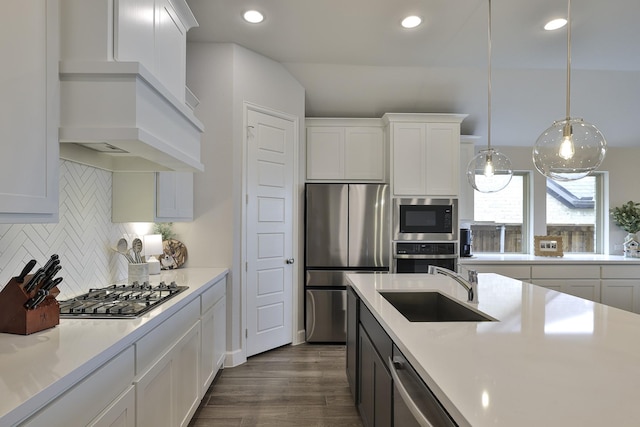 kitchen with a sink, light countertops, stainless steel appliances, dark wood-type flooring, and custom exhaust hood