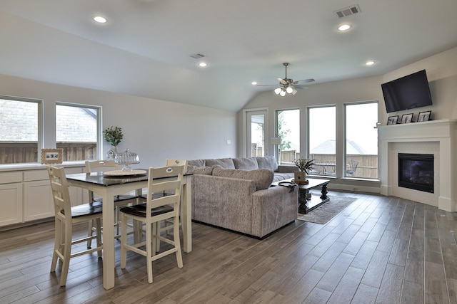 living room with visible vents, a ceiling fan, wood finished floors, and a healthy amount of sunlight