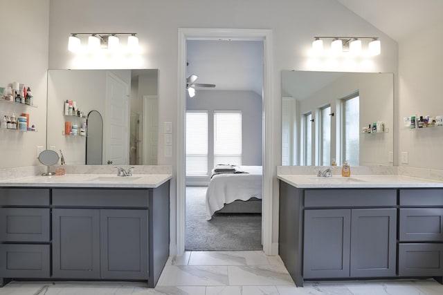 bathroom featuring a sink, a ceiling fan, marble finish floor, and lofted ceiling