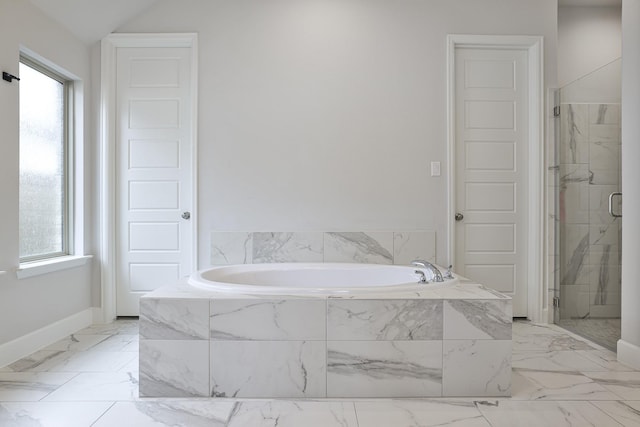 full bathroom with a bath, a healthy amount of sunlight, and a shower stall