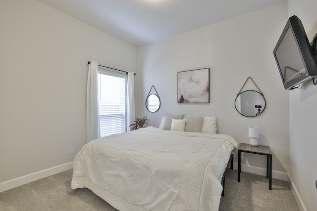 carpeted bedroom with baseboards