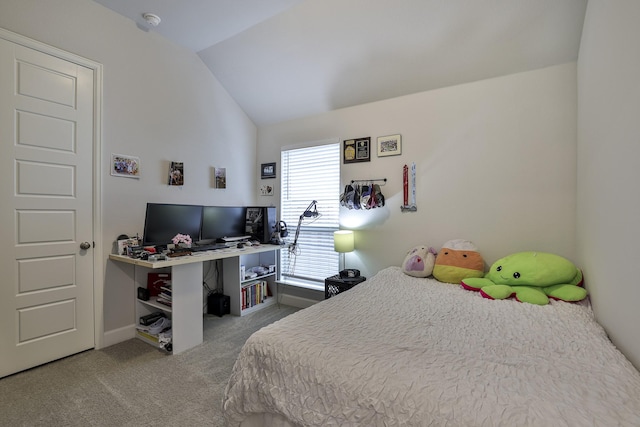 bedroom with baseboards, carpet, and lofted ceiling