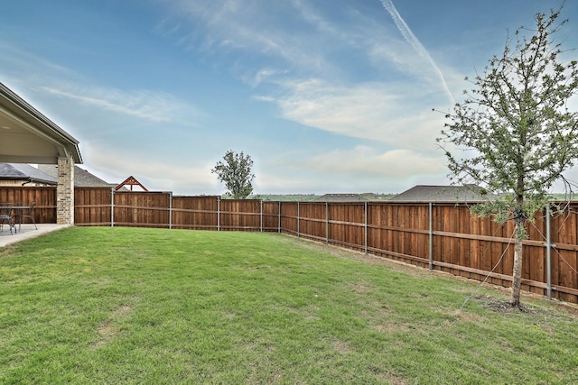 view of yard with a fenced backyard