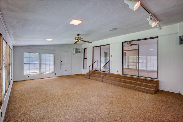 spare room with ceiling fan, carpet flooring, and a textured ceiling