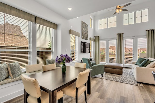 dining area featuring a ceiling fan, recessed lighting, a healthy amount of sunlight, and wood finished floors