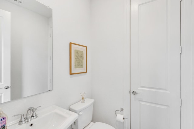 bathroom with a sink and toilet
