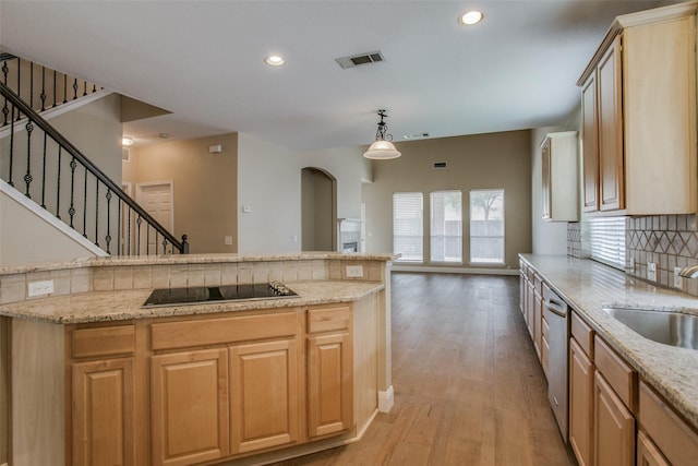 2501 Del Largo Way, Frisco, TX 75033 - kitchen with tasteful backsplash, a sink, dishwasher, light wood-type flooring, and visible vents