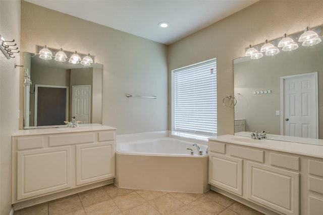 2501 Del Largo Way, Frisco, TX 75033 - bathroom with tile patterned flooring, two vanities, a sink, and a bath